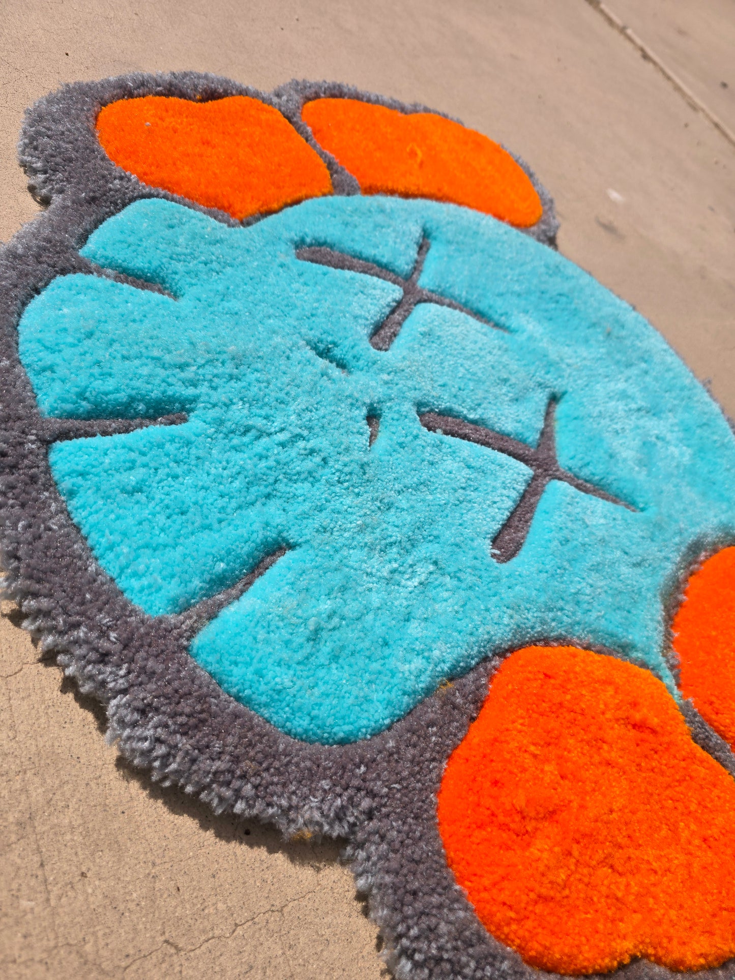 1. Custom Teal & Orange KAWS-Inspired Rug